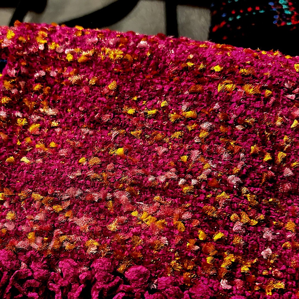 Hand-loomed scarf in raspberry with orange accents. Stunning.